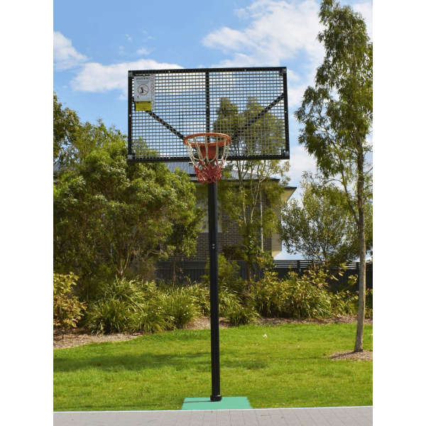  Grand Slam Reversible Basketball Tower in an outdoor setting with trees and grass.