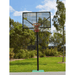 Grand Slam Reversible Basketball Tower in an outdoor setting with trees and grass.