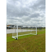 Grand Slam Senior Aluminium Soccer Goals on a grass field with a cloudy sky fenced area in background
