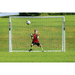HART Samba Match Goals – goalkeeper in red and black uniform attempting save in front of white soccer goal on green grass field.
