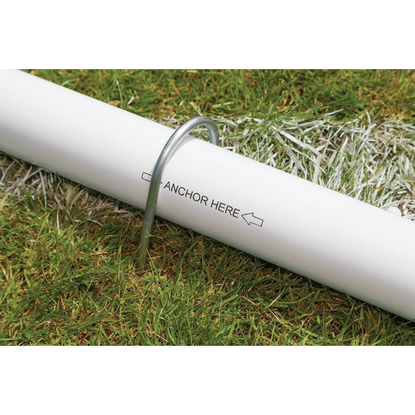 HART Samba Match Goals – white goal pipe with metal anchor and ‘ANCHOR HERE →’ label on green grass field.