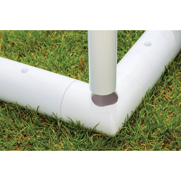 HART Samba Match Goals – white plastic corner joint connecting three tubular goalposts on green grass field.