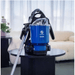 Pacvac Superpro Go Cordless Backpack Vacuum on a black table with a blurred indoor background