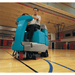 Tennant T7 Ride-On Floor Scrubber Basketball court cleaning with a man operating.