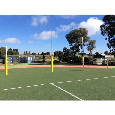 aussie rules goal posts with yellow padded posts